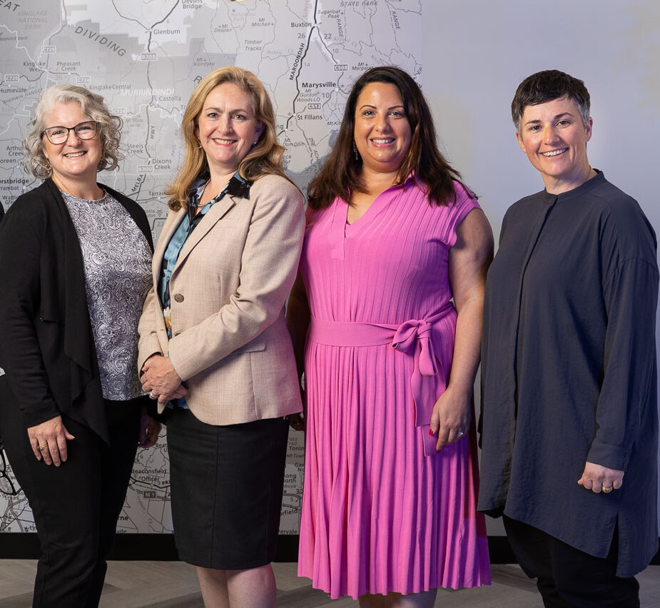 EMPHN's leadership team of five women standing and looking at the camera